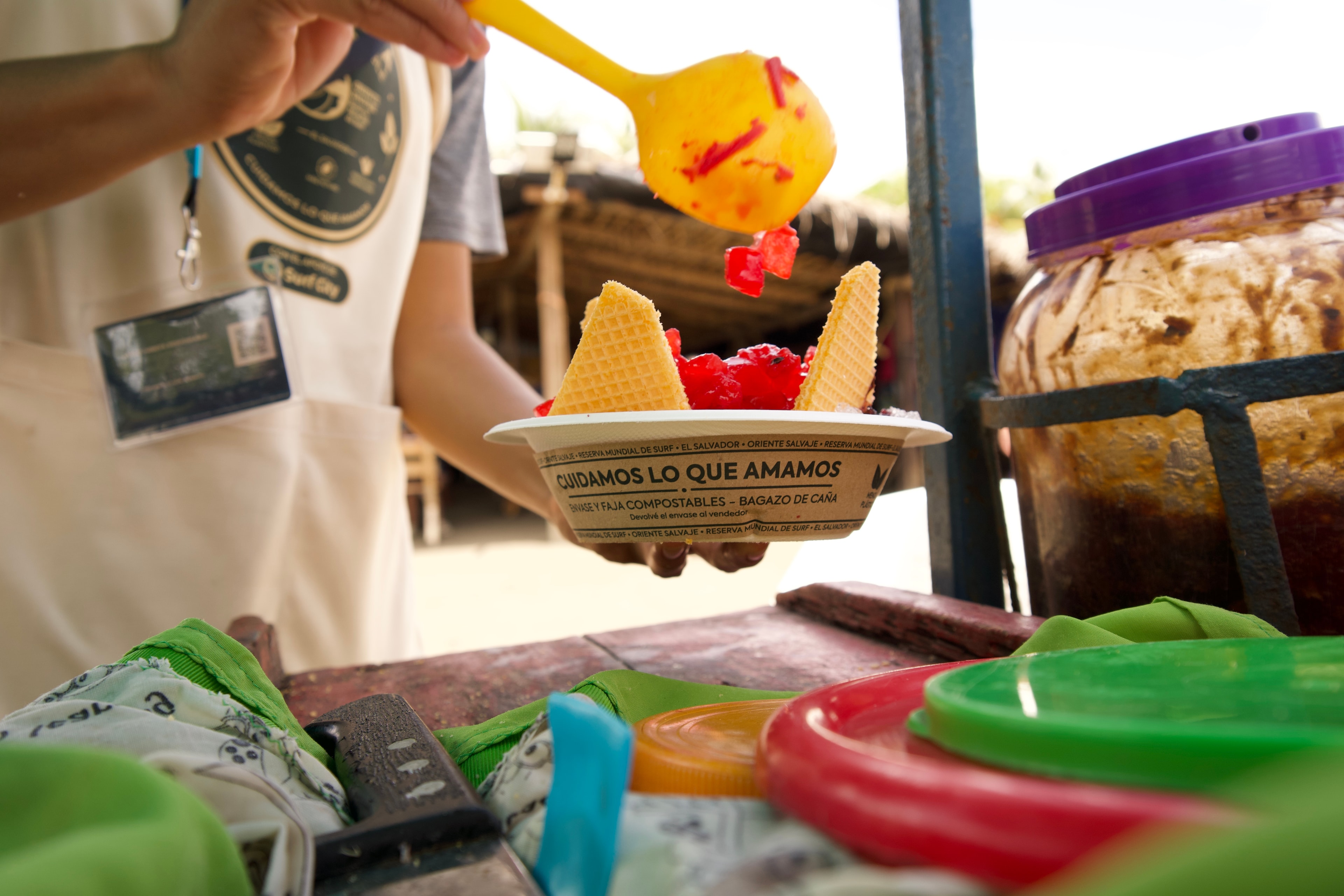 A minuta served in its bagasse cup with its paper band